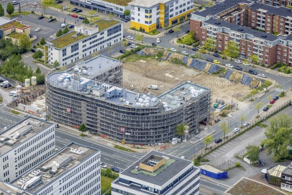 Aerial view, construction site and new office building on the corner of Frohnhauser Straße and Kurt-Jooss-Straße, City, Westviertel, Essen, Ruhr area, North Rhine-Westphalia, Germany, construction work, construction area, construction site, building plots, construction project, construction site, DE, Europe, aerial view, aerial photography, aerial photography, new building, overview, bird's-eye view, bird's-eye view, overview