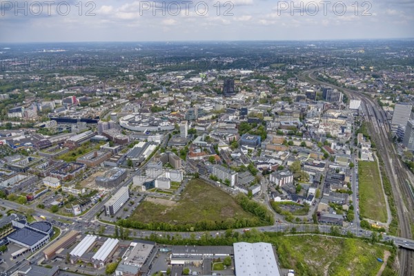 Aerial view, brownfield Schwanenkampstraße, construction site and new office building at the corner of Frohnhauser Straße and Kurt-Jooss-Straße, City, Westviertel, Essen, Ruhr area, North Rhine-Westphalia, Germany, construction work, construction area, construction site, building plots, construction project, construction site, DE, Europe, city centre, aerial view, aerial photography, aerial photography, new building, city centre, overview, bird's eye view, overview