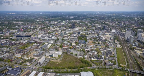 Aerial view, brownfield Schwanenkampstraße, construction site and new office building at the corner of Frohnhauser Straße and Kurt-Jooss-Straße, City, Westviertel, Essen, Ruhr area, North Rhine-Westphalia, Germany, construction work, construction area, construction site, building plots, construction project, construction site, DE, Europe, city centre, aerial view, aerial photography, aerial photography, new building, city centre, overview, bird's eye view, overview