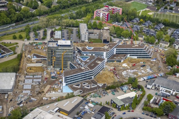 Aerial view, new construction and construction site ALDI-Nord Campus, Eckenbergstraße, Hängebank, Essen-Kray, Essen, Ruhr area, North Rhine-Westphalia, Germany, construction work, construction area, building site, building plots, construction crane, construction project, construction site, DE, development, Europe, commercial enterprises, commercial area, commercial park, commercial site, commercial use, industrial site, aerial photograph, aerial photography, aerial photography, new construction, overview, bird's eye view, bird's eye view, overview