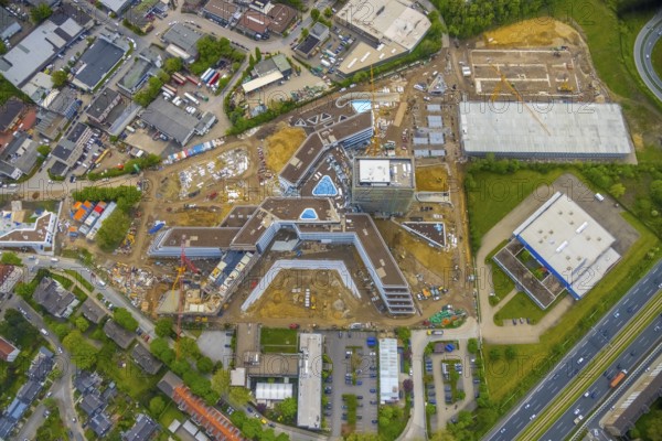 Aerial view, new construction and construction site ALDI-Nord Campus, Eckenbergstraße, Hängebank, Essen-Kray, Essen, Ruhr area, North Rhine-Westphalia, Germany, construction work, construction area, building site, building plots, construction crane, construction project, construction site, DE, development, Europe, commercial enterprises, commercial area, commercial park, commercial site, commercial use, industrial site, aerial photograph, aerial photography, aerial photography, new construction, overview, bird's eye view, bird's eye view, overview