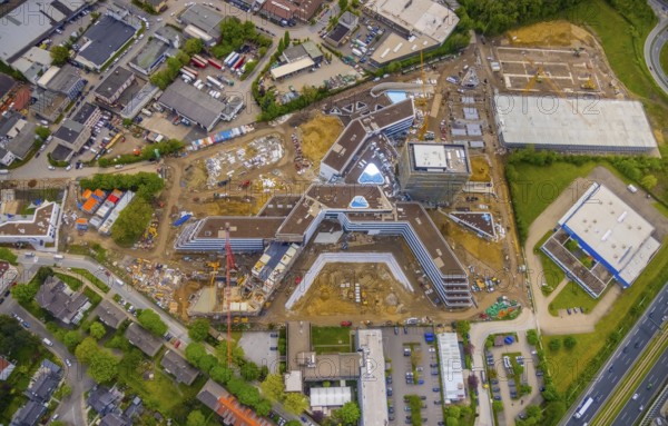 Aerial view, new construction and construction site ALDI-Nord Campus, in A-form, Eckenbergstraße, Hängebank, Essen-Kray, Essen, Ruhr area, North Rhine-Westphalia, Germany, construction work, construction area, building site, building plots, construction crane, construction project, construction site, DE, development, Europe, commercial enterprises, commercial area, industrial estate, commercial park, commercial site, commercial use, industrial site, aerial view, aerial photography, aerial photography, new construction, overview, bird's-eye view, birds-eyes view, overview