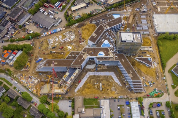 Aerial view, new construction and construction site ALDI-Nord Campus, in A-form, Eckenbergstraße, Hängebank, Essen-Kray, Essen, Ruhr area, North Rhine-Westphalia, Germany, construction work, construction area, building site, building plots, construction crane, construction project, construction site, DE, development, Europe, commercial enterprises, commercial area, industrial estate, commercial park, commercial site, commercial use, industrial site, aerial view, aerial photography, aerial photography, new construction, overview, bird's-eye view, birds-eyes view, overview