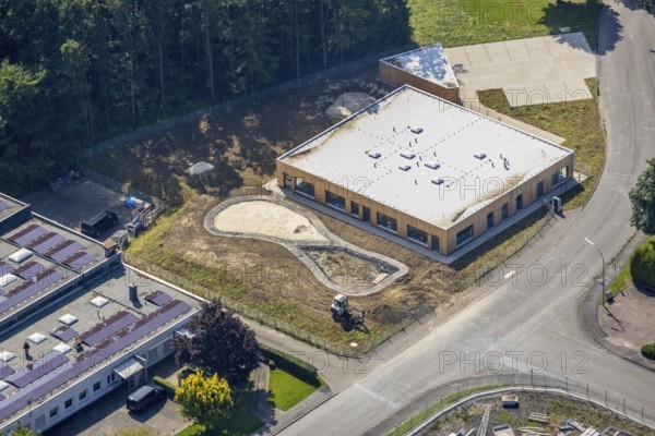 Aerial view, industrial park Höingen, construction site for new kindergarten, Höingen, Ense, Sauerland, North Rhine-Westphalia, Germany, construction work, construction site, building plots, construction project, construction site, DE, Europe, commercial enterprises, commercial area, commercial area, commercial park, commercial site, commercial use, industrial area, industrial site, kindergarten, day-care centre, day-care centre for children, aerial view, aerial photography, aerial photography, new construction, overview, bird's-eye view, overview