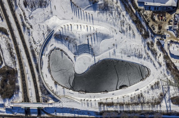 Aerial view, pond in snow-covered Krupp Park, Westviertel, Essen, Ruhr area, North Rhine-Westphalia, Germany, DE, Europe, shapes and colours, aerial view, aerial photography, aerial photography, park, shadow, snow, lake, pond, overview, bird's eye view, winter, winter landscape, birds-eyes view, overview