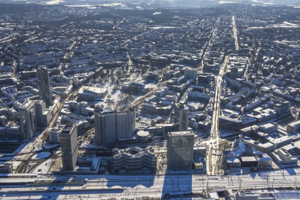 Aerial view, innogy high-rise building, construction site demolition RWE Haus, city centre, Essen, Ruhr area, North Rhine-Westphalia, Germany, demolition work, City, DE, Europe, Huyssenallee, city centre, aerial view, aerial photography, aerial photography, snow, skyline, city centre, overview, bird's eye view, winter, Ypsilon-Haus, birds-eyes view, overview