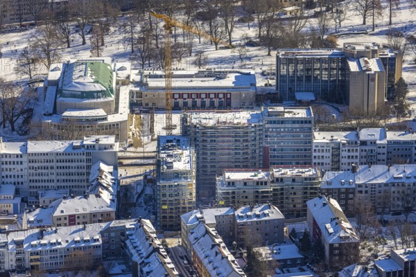 Aerial view, Philharmonie Essen, Sheraton Essen Hotel, construction site, new building complex with residential tower and senior flats, Huyssenallee, Essen-Holsterhausen, Essen, Ruhr area, North Rhine-Westphalia, Germany, construction work, construction area, construction site, building plots, construction measure, construction project, construction site, DE, Europe, gastronomy, hotel, hotel facilities, hotel industry, culture, art, aerial view, aerial photography, aerial photography, new building, snow, overview, events, bird's eye view, winter, birds-eyes view, overview