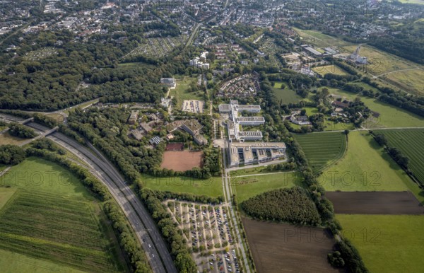 Aerial view, Westfälische Hochschule and Hans-Schwier-Berufskolleg in the district of Buer in Gelsenkirchen, Ruhr area, North Rhine-Westphalia, Germany, vocational school, education, educational institution, DE, Devesche Feld, Europe, Gelsenkirchen, community garden, college, KGV, allotment garden, allotment garden site, allotment garden association, allotment garden association recreation Buer, allotment gardener association, college school, teaching institute, aerial view, aerial photography, aerial photography, allotment garden, special school, overview, bird's eye view, housing estate Angerburger Straße, birds-eyes view, overview