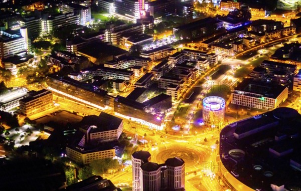 Aerial view, Berliner Platz, Funke Mediengruppe, Westviertel, Essen, Ruhr area, North Rhine-Westphalia, Germany, outdoor lighting, DE, twilight, shopping centre, shopping square, shopping mall, Europe, light pollution, aerial view, aerial photography, aerial photography, media house, media company, night aerial photography, shopping, shopping centre, streetlights, street lamps, overview, publishing house, publishing industry, bird's-eye view, illuminated, illuminated houses, illuminated house, birds-eyes view, artificial light, night, nightflight, overview