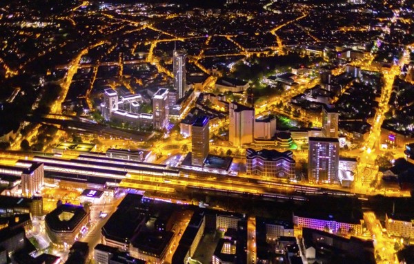 Aerial view, Essen central station, business district, Westenergie tower, demolition Ypsilon-Haus, Essen-Holsterhausen, Essen, Ruhr area, North Rhine-Westphalia, Germany, outdoor lighting, railway station, construction work, construction site, building site, construction project, construction site, DE, Deutsche Bahn AG, twilight, Europe, commercial buildings, central station, main station, light pollution, aerial view, aerial photography, aerial photography, night aerial photography, streetlights, street lamps, tower, overview, bird's eye view, illuminated, illuminated houses, illuminated house, birds-eyes view, artificial light, night, nightflight, overview