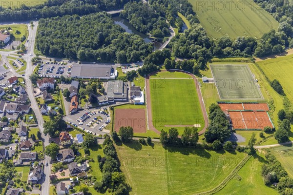 Aerial view, Edeka supermarket local supply centre, sports field Niederense, Hubertushalle Schützenverein, Niederense, Ense, Sauerland, North Rhine-Westphalia, Germany, DE, Edeka supermarket, shopping markets, shopping place, shopping centre, Europe, football field, football stadium, aerial view, aerial photography, aerial photography, local supply centre, parking, Schützenbruderschaft, Schützenbruderschaft St. Hubertus 1824 Niederense, Schützenhalle, Schützenverein, sports, sports facilities, sports field, sports centre, supermarket, tennis, tennis facility, tennis courts, overview, bird's-eye view, overview