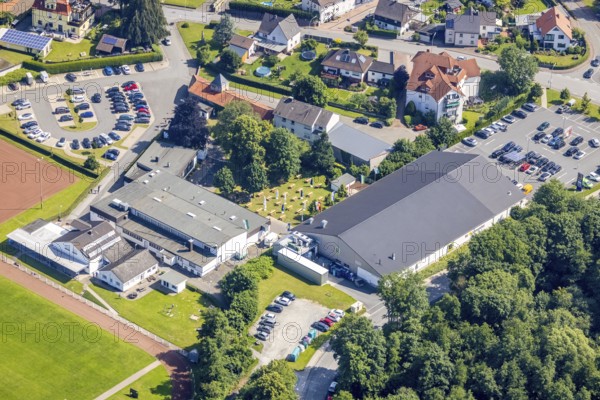 Aerial view, Hubertushalle Schützenverein, garden with beer tables and flags, Niederense, Ense, Sauerland, North Rhine-Westphalia, Germany, DE, Edeka supermarket, Europe, aerial view, aerial photography, aerial photography, local supply centre, Schützenbruderschaft, Schützenbruderschaft St. Hubertus 1824 Niederense, Schützenhalle, Schützenverein, overview, bird's eye view, birds-eyes view, overview