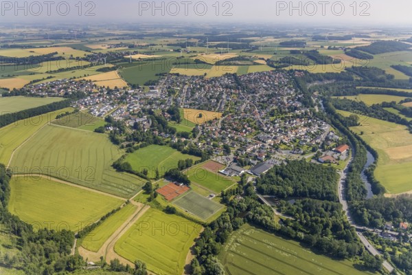 Aerial view, local view, Edeka supermarket local supply centre, sports field Niederense, Hubertushalle Schützenverein, river Möhne, Niederense, Ense, Sauerland, North Rhine-Westphalia, Germany, DE, Edeka supermarket, shopping markets, shopping place, shopping centre, Europe, football field, football stadium, aerial view, aerial photography, aerial photography, local supply centre, parking, Schützenbruderschaft, Schützenbruderschaft St. Hubertus 1824 Niederense, Schützenhalle, Schützenverein, sports, sports facilities, sports field, sports centre, supermarket, tennis, tennis facility, tennis courts, overview, bird's-eye view, overview