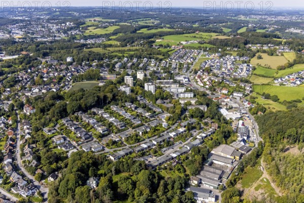 Aerial view, commercial area at Hembecker Talstraße and housing estate Büttenberger Straße in the district Büttenberg in Ennepetal, Ruhr area, North Rhine-Westphalia, Germany, tree mortality, bark beetle damage, bark beetle plague, DE, Ennepetal, Europe, spruce mortality, commercial enterprises, commercial area, commercial area, commercial site, commercial use, property tax, high-rise housing estate, real estate, industrial area, industrial site, clear-cutting, aerial view, aerial photography, aerial photography, overview, bird's-eye view, forest, forest damage, forest dieback, residential area, housing and living, residential area, residential buildings, housing quality, residential neighbourhood, housing estate, birds-eyes view, overview