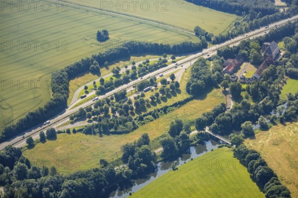 Aerial view, Haus Füchten, motorway A445 with parking Haus Füchten and parking Ruhr Valley, Hünningen, Ense, Sauerland, North Rhine-Westphalia, Germany, motorway A445, castle, DE, Europe, manor house, aerial view, aerial photography, aerial photography, parking, castle, overview, bird's eye view, farm building, birds-eyes view, historical sight, overview