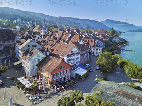 Old town with the Landsgemeindeplatz surrounded by street cafés and restaurants, behind the Zytturm, Old Town, Zug, Canton Zug, Switzerland