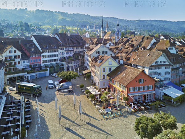 Old town with the Landsgemeindeplatz surrounded by street cafés and restaurants, behind the Zytturm, Old Town, Zug, Canton Zug, Switzerland