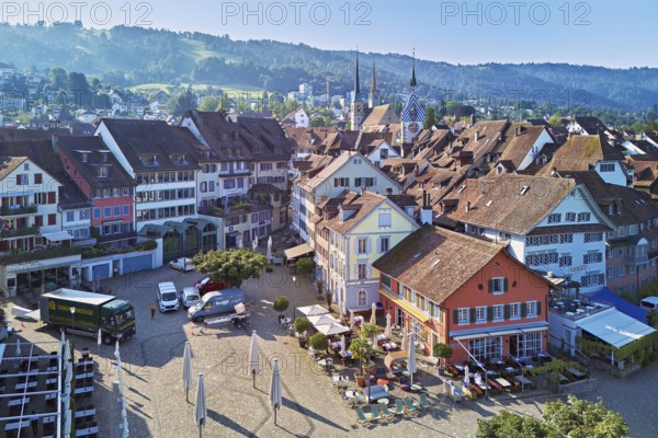 Old town with the Landsgemeindeplatz surrounded by street cafés and restaurants, behind the Zytturm, Old Town, Zug, Canton Zug, Switzerland