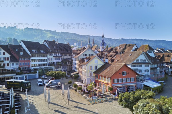 Old town with the Landsgemeindeplatz surrounded by street cafés and restaurants, behind the Zytturm, Old Town, Zug, Canton Zug, Switzerland