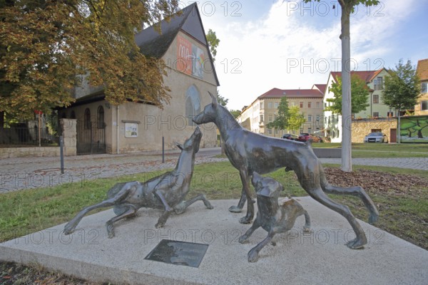 Sculpture Dobermann by Kerstin Stöckel 2019, memorial to breeder of dog breed and namesake Karl Friedrich Louis Dobermann, three playing dog figures, bronze sculpture, modern art, dog breeding, Apolda, Thuringia, Germany