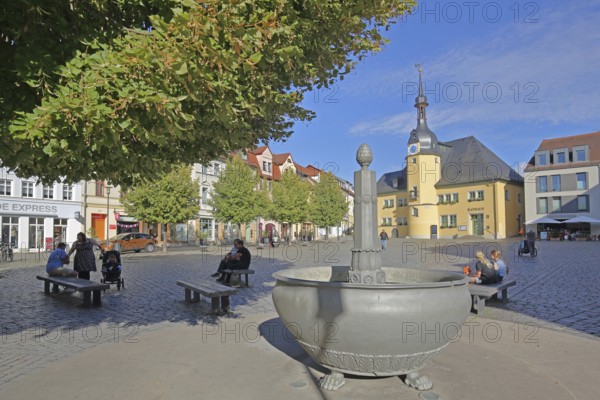 Market square with market fountain and town hall, Renaissance, people sitting on a bench, market, Apolda, Thuringia, Germany