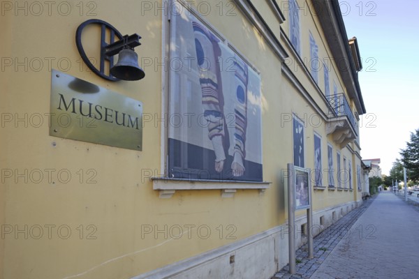 Bell museum building with inscription and banner, bell, town museum, GlockenStadtMuseum, Apolda, Thuringia, Germany