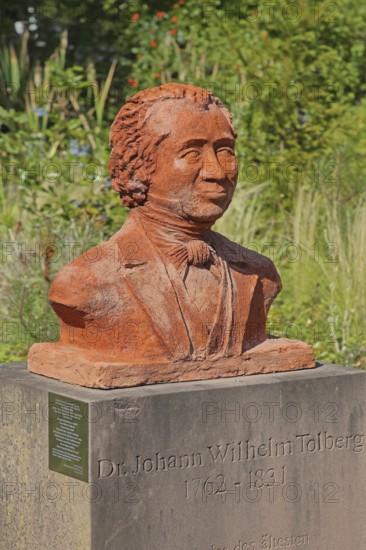 Monument to the physician and doctor Johann Wilhelm Tolberg, bust, inscription, Solepark, spa garden, Bad Salzelmen, Schönebeck, Saxony-Anhalt, Germany