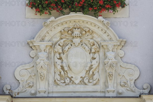 City coat of arms with decorations, relief, figures, town hall, market square, Schönebeck, Saxony-Anhalt, Germany