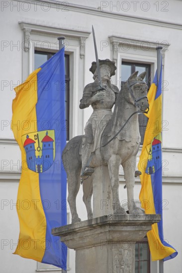 Roland statue with town flags, sculpture, equestrian figure, equestrian statue, market square, town hall, Haldensleben, Saxony-Anhalt, Germany