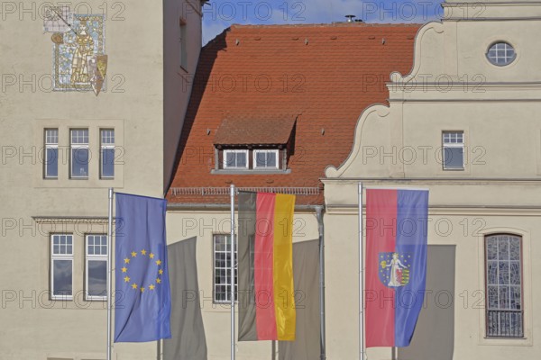Renaissance town hall with EU flag, German national flag and town flag, three, flags, Coswig, Fläming, Saxony-Anhalt, Germany