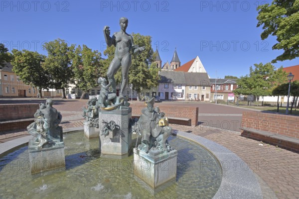 Market fountain by Frank Sobirey on the history of the town, nude female figure and putti, modern art, bronze sculpture, market square, Aken, Saxony-Anhalt, Germany