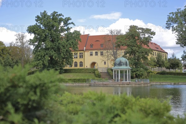 Castle and round pavilion at the spa gardens pond, Goethe School, Goethepark, Bad Lauchstädt, Saxony-Anhalt, Germany