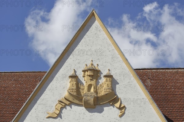 Town coat of arms in relief on the gable of the town hall, Barby, Saxony-Anhalt, Germany