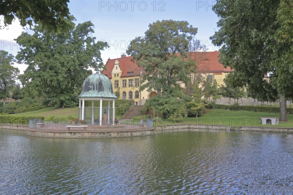 Castle and round pavilion at the spa gardens pond, Goethe School, Goethepark, Bad Lauchstädt, Saxony-Anhalt, Germany