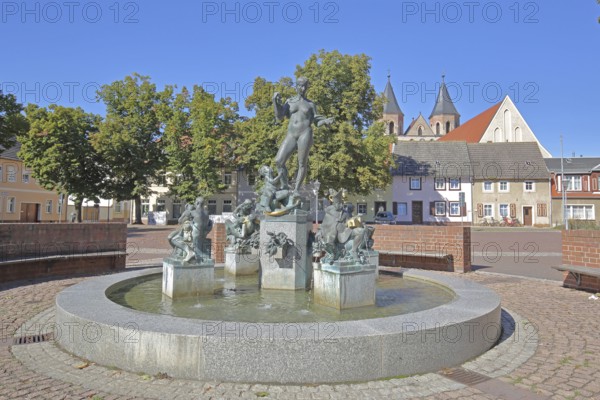 Market fountain by Frank Sobirey on the history of the town, nude female figure and putti, modern art, bronze sculpture, market square, Aken, Saxony-Anhalt, Germany