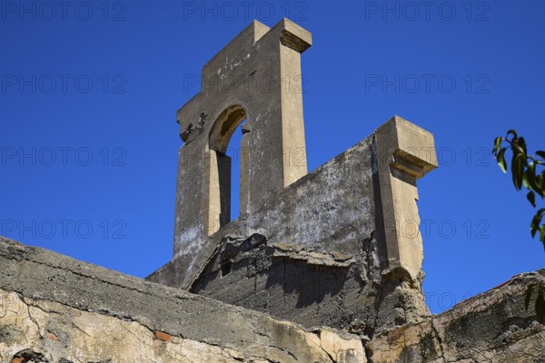 Tower-like structure with crumbling façade in front of a clear blue sky, Old Silk Factory, German Wehrmacht military prison, concentration camp, Lost Place, Kattavia, Rhodes, Dodecanese, Greek Islands, Greece
