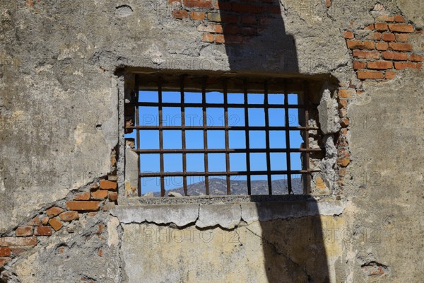 Barred window with shadows on old, rustic brick walls, Old silk factory, Military prison of the German Wehrmacht, Concentration camp, Lost Place, Kattavia, Rhodes, Dodecanese, Greek Islands, Greece