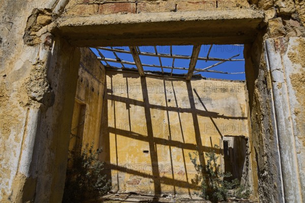 Sunlight casts shadows through dilapidated wooden beams in an old room, Old Silk Factory, German Wehrmacht military prison, concentration camp, Lost Place, Kattavia, Rhodes, Dodecanese, Greek Islands, Greece