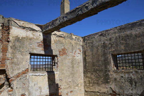 Interior view of a dilapidated building with rustic bricks and lattice windows, Old silk factory, German Wehrmacht military prison, concentration camp, Lost Place, Kattavia, Rhodes, Dodecanese, Greek Islands, Greece