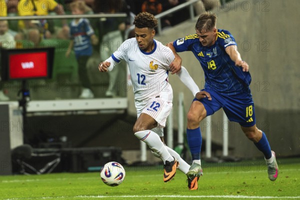 WROCLAW, POLAND - SEPTEMBER 5, 2025: Qualifications for FIFA 2026. Football match Ukraine vs France 0:2. Doue Desire (L) Yarmolyuk (R)