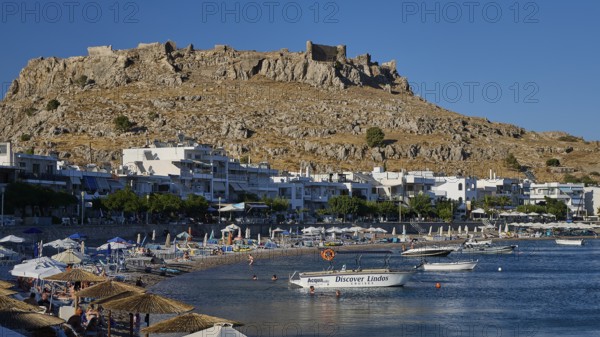 Feraklos Fortress, Feraklos, Picturesque coastal town with a castle on the hill and boats on the sandy beach, Bay, Charaki, Haraki, East Coast Rhodes, Rhodes, Dodecanese, Greek Islands, Greece