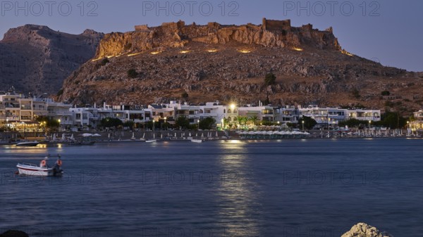 Feraklos fortress, night view of a castle above a quietly lit coastal town by the sea, bay, Charaki, Haraki, east coast of Rhodes, Rhodes, Dodecanese, Greek Islands, Greece