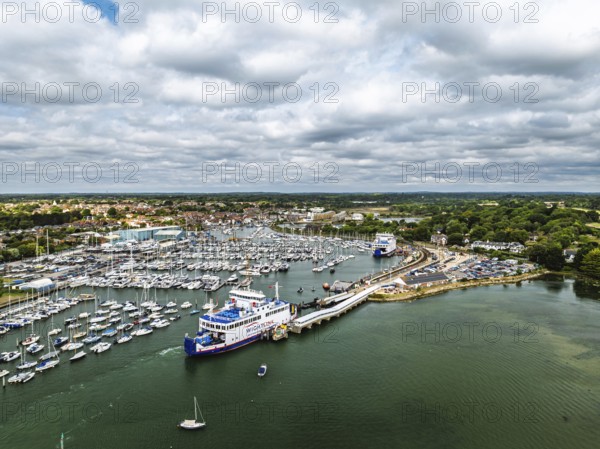 Wight Light car ferry to Isle of Wight on Lymington River and marina from drone, Lymington, New Forest, Hampshire, England, United Kingdom