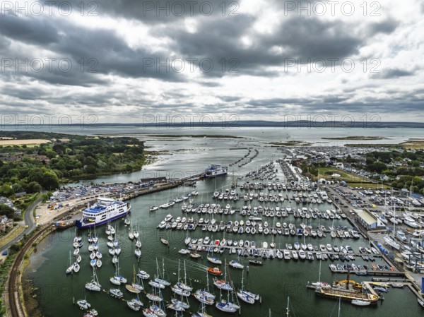Wight Light car ferry to Isle of Wight on Lymington River and marina from drone, Lymington, New Forest, Hampshire, England, United Kingdom