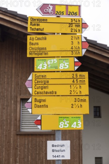 Signpost at the railway station, Staziun Sedrun, Surselva, Graubünden, Switzerland