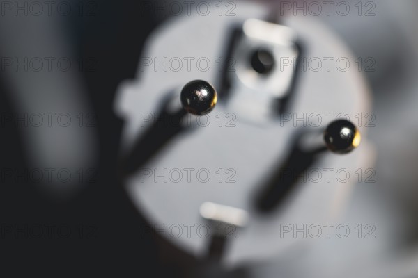 Close-up of a power plug, Schuko plug, with focus on the contact pins, symbol image for, electricity, electrical energy, power consumption, studio shot, Germany