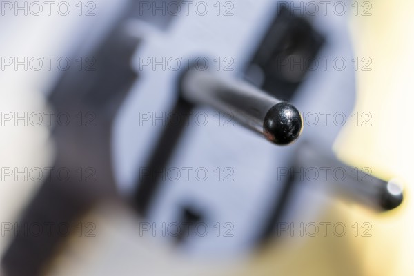 Close-up of a power plug, Schuko plug, with focus on the contact pins, symbol image for, electricity, electrical energy, power consumption, studio shot, Germany