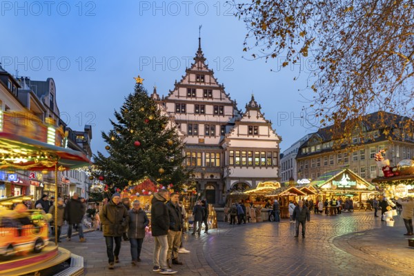 Christmas market at the colourfully illuminated Paderborn Town Hall at duskin Paderborn, North Rhine-Westphalia, Germany