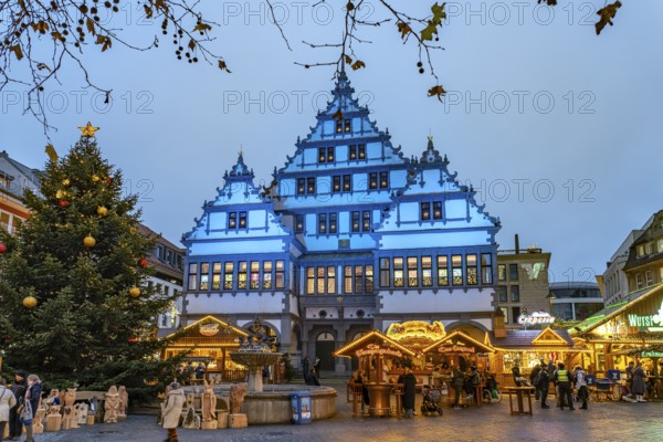 Christmas market at the colourfully illuminated Paderborn Town Hall at duskin Paderborn, North Rhine-Westphalia, Germany