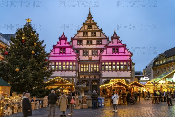 Christmas market at the colourfully illuminated Paderborn Town Hall at duskin Paderborn, North Rhine-Westphalia, Germany